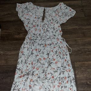 This is a blue flowey romper that has a trail in the back.